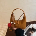 Brown suede half-moon handbag with dual zippers and decorative tassel plush charms - With Charm / Brown