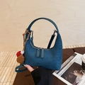 Blue crescent moon underarm bag with decorative pompom charms and suede finish - With Charm / Blue