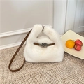 White plush faux fur bucket bag with brown leather straps and metallic twist lock - White