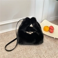 Chic black plush bucket bag featuring premium faux fur texture and silver metal clasp - Black