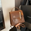 Brown woven texture convertible backpack and handbag with beaded charm and metal buckle - Brown with Pendant