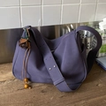 Deep purple faux suede crossbody bag with wide strap and brown flower charm - Purple With Pendant