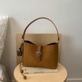 Brown frosted suede shoulder bag with buckled strap and decorative round charms - With Charm / Brown