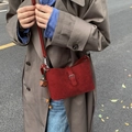 Red frosted crossbody bag with decorative buckle and charm on autumn trench coat - With Charm / Red
