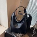Minimalist black pebbled leather hobo bag with adjustable silver buckle strap - Black