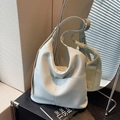 Minimalist light grey hobo bag with pebble leather texture and a front pocket - Light Blue