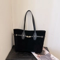 Chic black oversized tote bag in premium matte suede with elegant gold hardware lock - Black