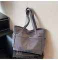Detail view of grey corduroy tote bag with side pockets and sturdy shoulder straps - One Size / Gray