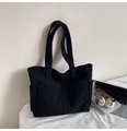 Detail of black corduroy tote bag showing multiple pockets for daily organization - One Size / Black