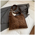 Detail of adjustable metal buckle and leopard print suede fabric on a hobo bucket bag - Leopard Brown