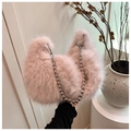 Close-up of pink fluffy plush bag with a chic silver beaded chain and soft crescent shape - Beige Grey