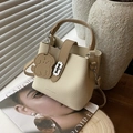Chic cream and brown bucket bag in lychee leather with H buckle and puppy charm - Off White