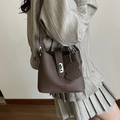 Brown lychee leather bucket bag with dog charm and fashion crossbody shoulder strap - Brown