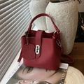 Red lychee pattern leather bucket bag with silver H-buckle and dog charm - Red