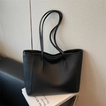 Classic black tote bag in lychee pattern leather with double handles for daily commute - Black