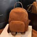 Brown faux suede backpack with a front pocket and matching round coin pouch attachment - Brown