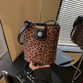 Chic leopard print bucket bag with black leather flap and silver buckle closure - Leopard Print