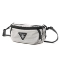 Close-up of light grey checkered cross-body bag featuring dual zippers and logo patch - Gray
