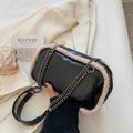 Glossy black crossbody bag with cream faux fur trim and gold chain strap for winter - Black