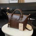 Minimalist crossbody tote bag in dark brown woven leather texture with shoulder strap - Brown