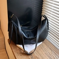 Minimalist black leather half-moon shoulder bag with large capacity and sleek straps - Black