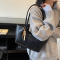 Retro black faux leather woven tote bag with beaded charm and gold lettering detail - Black with Pendant