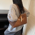 Brown oil wax leather tote bag with colorful beads and fringe tassel on a model - Brown with Pendant