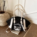 Black quilted tote bag with white faux fur trim and cat embroidery by Ousheya brand - Black