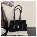 Detail of a vintage black suede underarm bag featuring a silver metal buckle closure - Black