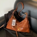 Glossy brown faux leather tote bag with heart zipper detail and gold hardware finish - Brown