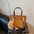 Caramel suede bucket bag with leather handles and cute plush dog charm decoration - Brown with Pendant