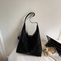 Black large capacity hobo tote bag with white contrast stitching and round charm - Black