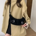 Retro black suede crescent bag with silver buckles worn with a khaki trench coat - Black