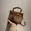 Bolso cubo vintage de cuero marrón y lona con herrajes dorados y doble asa - Marrón