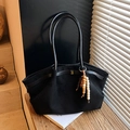 Large black suede tote bag with leather handles and decorative beads on a wooden desk - With Pendant / Black