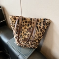 Plush leopard print tote bag with brown leather handles and soft faux fur texture - Leopard Print