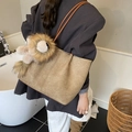 Khaki woven tote bag with brown handles and a cute lion plush charm accessory - With Charm / Khaki