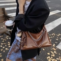 Retro brown glossy faux leather shoulder bag with silver chains and fringe detail - With Charm / Brown