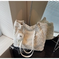 Detail of white fuzzy tote bag featuring silver chain strap and signature eye bag charm - Off-white