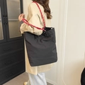 Large black nylon tote bag with unique red rope handles for commuting and casual wear - Black