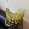 Fruity green suede crescent bag featuring long tassels and knotted rope handle - Green