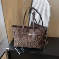 Chic leopard print tote bag with brown handles and a stylish gold buckle detail - Leopard Coffee