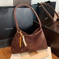 Retro dark brown suede shoulder bag featuring a bohemian wood bead tassel charm - Brown