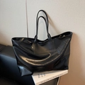 Chic black high-capacity tote bag in glossy leather for urban daily commute - Black