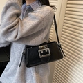 Minimalist black faux leather underarm bag with a stylish large silver square buckle - Black