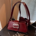 Chic dark red shoulder bag in glossy faux leather with a large silver buckle detail - Burgundy