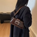 Dark coffee glossy leather underarm bag featuring a large silver buckle and wide strap - Coffee