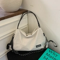 Detail of white large capacity tote bag featuring black fashion label and rope strap - Off-white