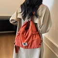 Oranje geplooide rugzak met Iron Bear-patch en trekkoorddetails voor vrouwen - Oranje