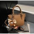 Brown litchi grain mini tote bag with adjustable strap and cute plush charm - Khaki